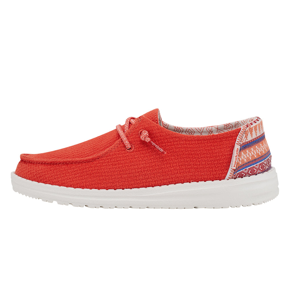 Red casual shoe with white sole on a white background