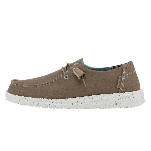 Brown casual shoe with white sole on a white background