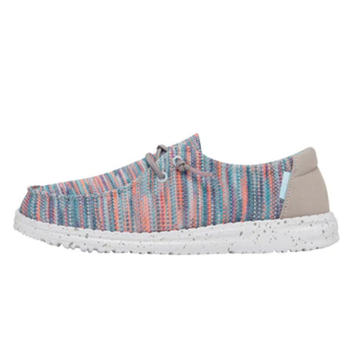 Multicolored striped shoe with a white sole on a white background