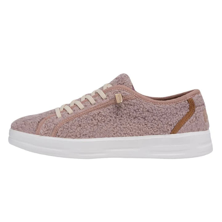 Pink sneaker with white sole on a white background
