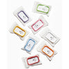Assorted colored silicone touchland hand sanitizer cases in clear packaging on a white background